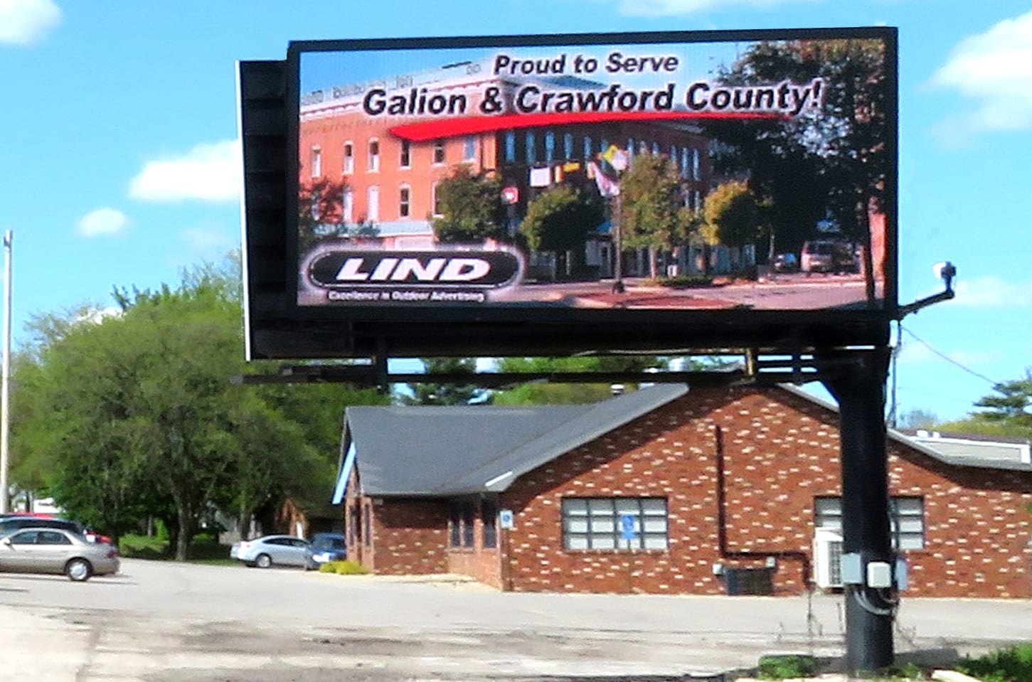 An image of Lind's digital billboard in Galion. On the board, there is an image reading "Proud to Serve Galion & Crawford County!"