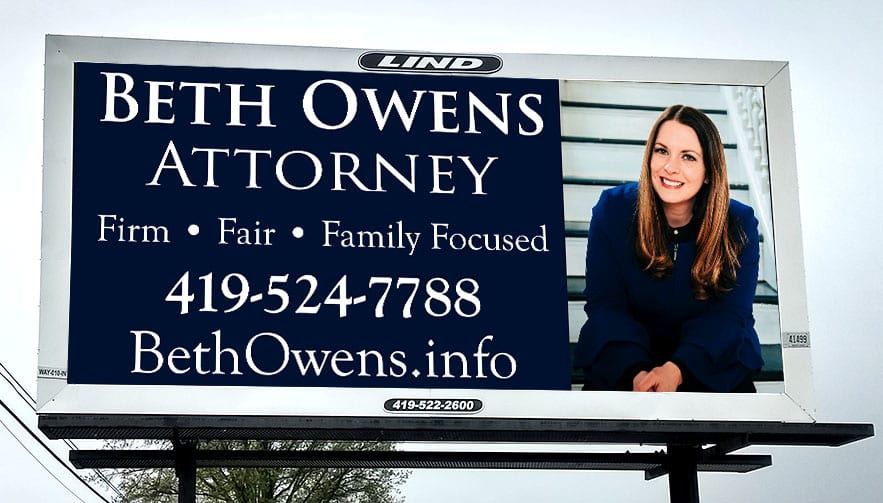 An image of a billboard reading "Beth Owens, Attorney." 