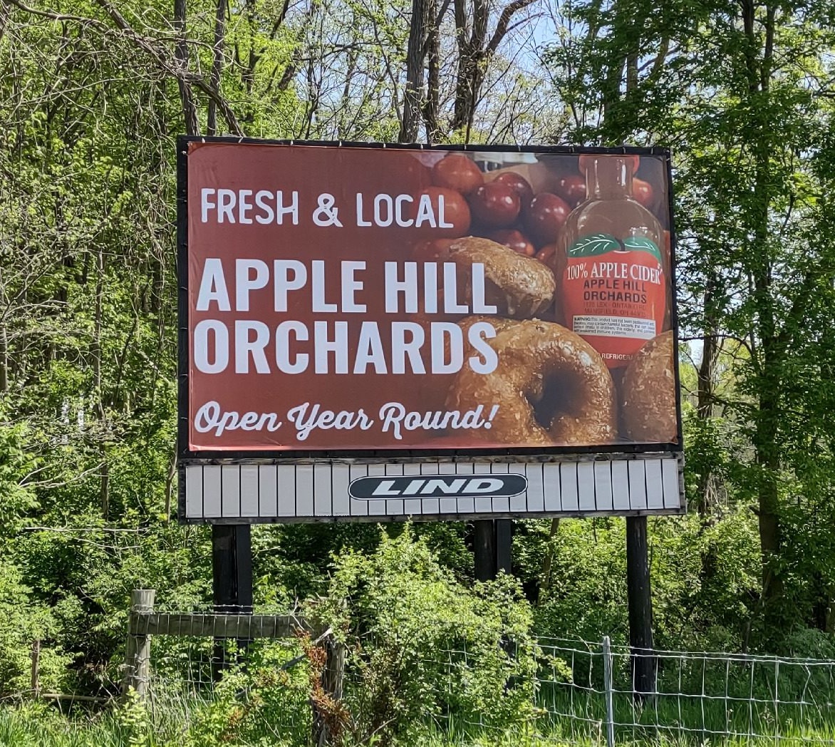 Apple Hill Orchard billboard, donuts billboard, apple cider billboard