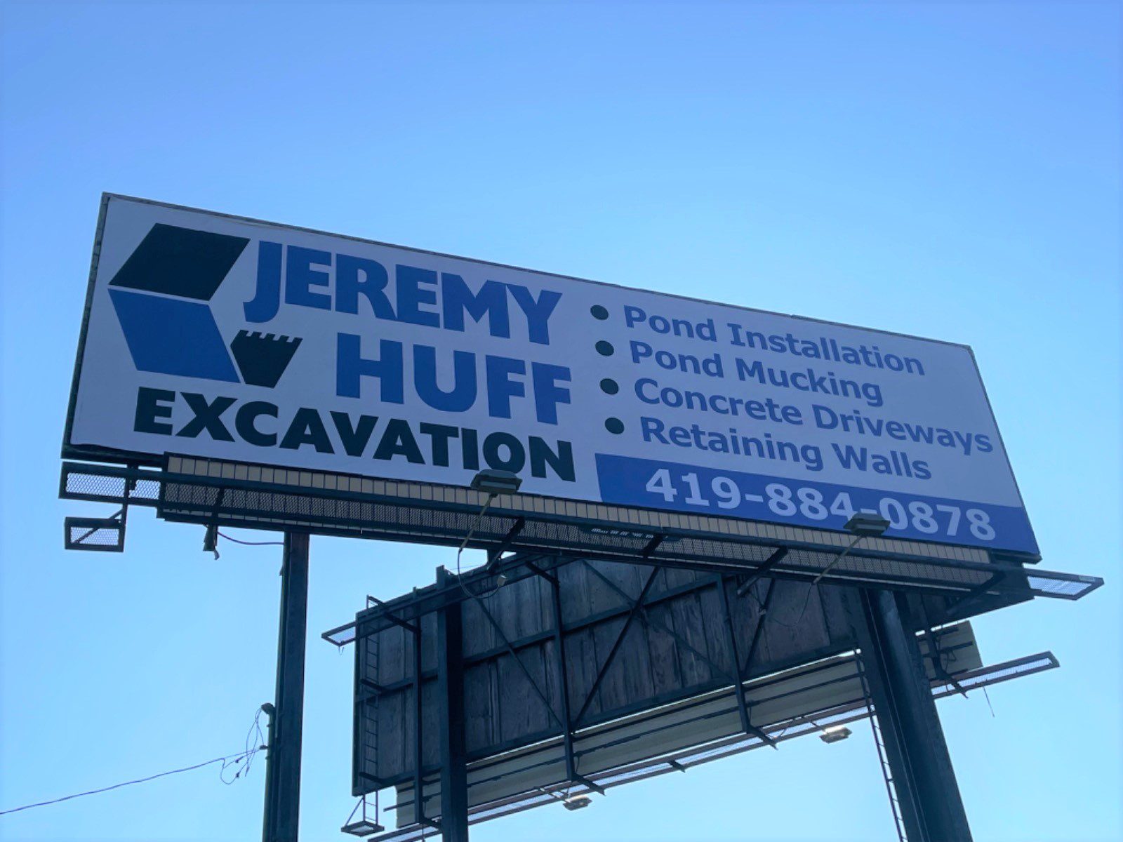 Huff Excavation billboard, excavating billboard